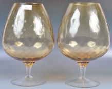 LARGE PAIR OF AMBER GLASS EMPOLI BRANDY GLASSES
