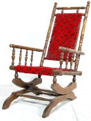 A 19TH CENTURY VICTORIAN MAHOGANY ROCKING CHAIR.