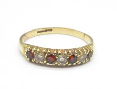 9CT GOLD AND RED STONE RING