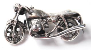 A STAMPED 925 SILVER BROOCH IN THE FORM OF A MOTORBIKE.
