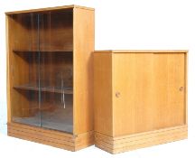 TWO MID CENTURY OAK SLIDING DOOR BOOKCASES