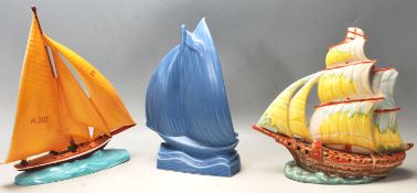 THRE 20TH CENTURY STUDIO ART POTTERY VASES IN A SHAPE OF BOATS AT SEA