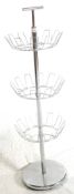 A RETRO 20TH CENTURY CHROME METAL REVOLVING SHOE RACK