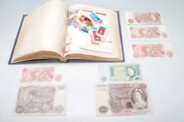 BRITISH BANK OF ENGLAND BANKS NOTES TOGETHER WITH A VINTAGE STAMP ALBUM