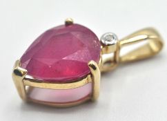 9CT GOLD AND PINK STONE PENDANT