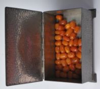 LOOSE BUTTERSCOTCH AMBER BEADS IN PEWTER BOX
