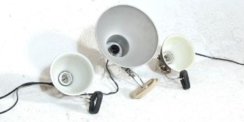 A COLLECTION OF THREE RETRO CONICAL CLAMP DESK LAMP LIGHTS.