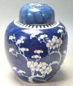 19TH CENTURY CHINESE GINDER JAR PAINTED IN BLUE AND WHITE PRUNUS PATTERN