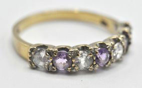 9CT GOLD PURPLE AND WHITE STONE LADIES RING