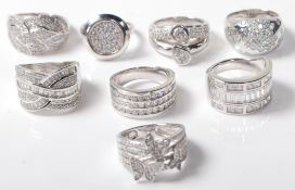 EIGHT LADIES SILVER AND WHITE STONE RINGS