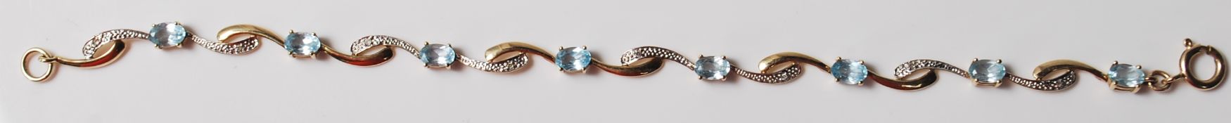 9CT GOLD AND BLUE STONE LINE BRACELET