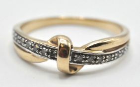 TWO TONE 9CT GOLD KNOT RING SET WITH WHITE STONES