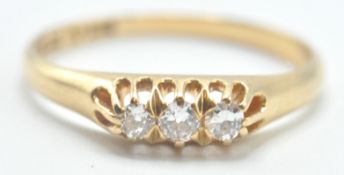 18CT GOLD AND THREE STONE DIAMOND RING