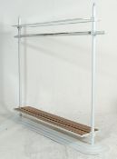 A RETRO 20TH CENTURY HABERDASHERY SHOP FLOOR STANDING CLOTHES RAIL