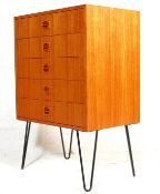 A VINTAGE DANISH INSPIRED CHEST OF DRAWERS WITH LOZENGES HANDLES AND METAL HAIRPIN LEGS