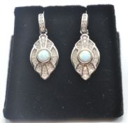 A PAIR OF STAMPED 925 SILVER ART DECO STYLE EARRINGS SET WITH OPALS AND CUBIC ZIRCONIA