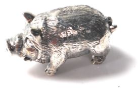 A STAMPED STERLING SILVER FIGURE OF A PIG
