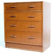 A MID CENTURY OAK G-PLAN SECRETAIRE CHEST OF DRAWERS