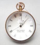 A SPHERICAL SWISS GLASS CLOCK HAVING BRASS BANDING AND EXPOSED WORKINGS.
