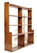 A 1930'S OAK LIBRARY WATERFALL OPEN BOOK CASE