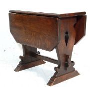 1930’S OAK DROP LEAF COFFEE TABLE WITH METAMORPHIC SPINNING TOP