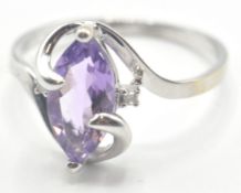 9CT WHITE GOLD RING - MARQUISE SHAPED PURPLE RING
