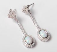 A PAIR OF STAMPED 925 SILVER DROP EARRINGS SET WIT