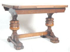 A mid 20th Century vintage oak draw leaf dining ta