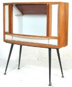 A RETRO MID 20TH CENTURY COCKTAIL CABINET.