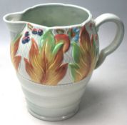 A CLARICE CLIFF WATER JUG WITH CELTIC LEAF AND BER