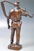 HANS MüLLER AUSTRIAN BRONZE OF A FARMER WITH SCYTHE