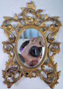 AN ANTIQUE BRASS ORNATE DRESSING TABLE MIRROR