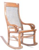 EARLY 20TH CENTURY CHINESE ANTIQUE HARDWOOD AND CANE ROCKER