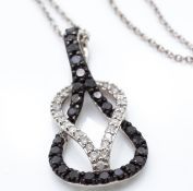 A 14ct White Gold & diamond pendant necklace