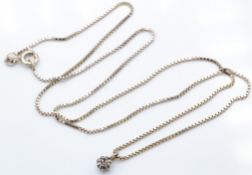 A hallmarked 14ct white gold and diamond pendant necklace