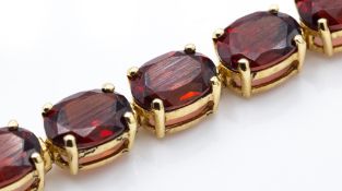 A Hallmarked 9ct Gold & Garnet Bracelet