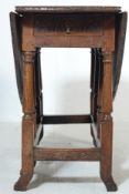 19TH CENTURY CARVED OAK JACOBEAN DROP LEAF TABLE