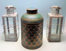 TWO VINTAGE RETRO 20TH CENTURY METAL AND GLASS CANDLE LANTERNS TOGETHER WITH A TEA CANISTER