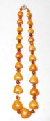 EARLY 20TH CENTURY HEART SHAPED AMBER NECKLACE STRING