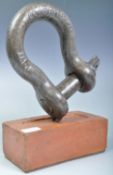 RETRO VINTAGE SHACKLE DOORSTOP ON A BRISTOL BRICK