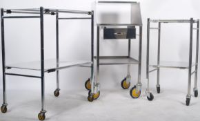 GROUP OF THREE STAINLESS STEEL DENTIST TROLLEYS