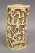 A 19TH CENTURY CHINESE CARVED IVORY OPENWORK TUSK SECTION, carved to depict landscapes upon