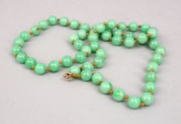 A GOOD SET OF APPLE GREEN CHINESE JADE BEADS, 66CM.