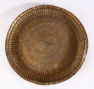 A 19TH CENTURY INDAIN BRASS CHARGER / DISH, with embossed decoration,