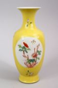 A CHINESE REPUBLIC STYLE YELLOW GROUND FAMILLE JAUNE PORCELAIN VASE, with panel decoration of