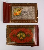 A GOOD 19TH CENTURY PERSIAN PAINTED LACQUER AND WHITE METAL ISFAHAN BOOK COVER, with painted