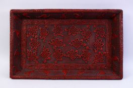 A GOOD 19TH CENTURY CHINESE CINNABAR LACQUER CARVED TRAY, the tray carved in relief to depict bats