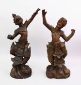 TWO GOOD INDIAN CARVED WOODEN DANCING FIGURES, 56cm high