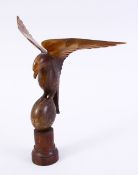 A CARVED HORN FIGURE OF A BIRD, possibly rhino 20cm high.