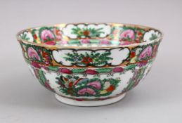 A CHINESE CANTON STYLE FAMILLE ROSE PORCELAIN BOWL, base with red seal mark. 20cm.